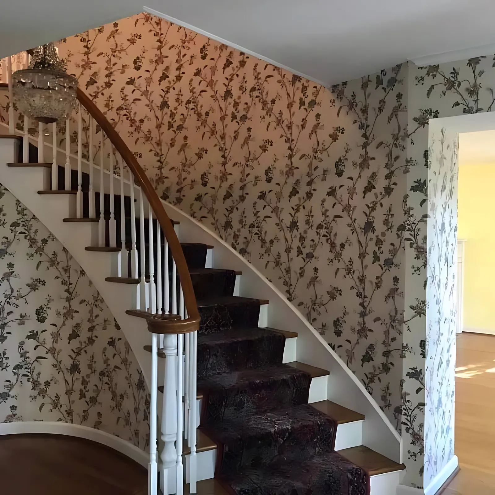 Before: curved staircase foyer
