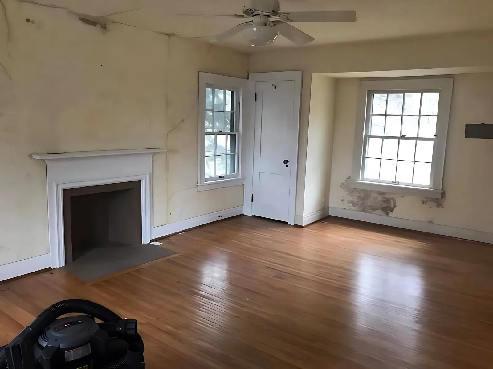 Before: front room with fireplace