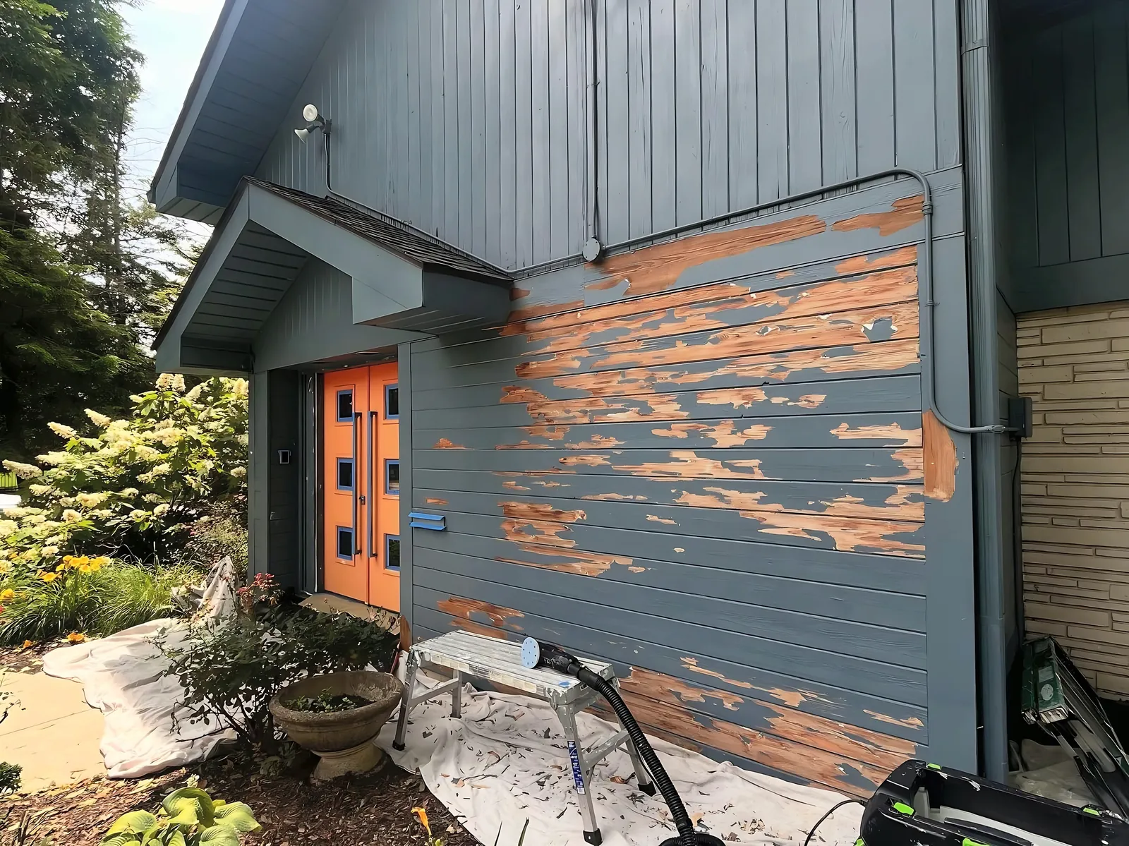 Before: peeling siding to finished