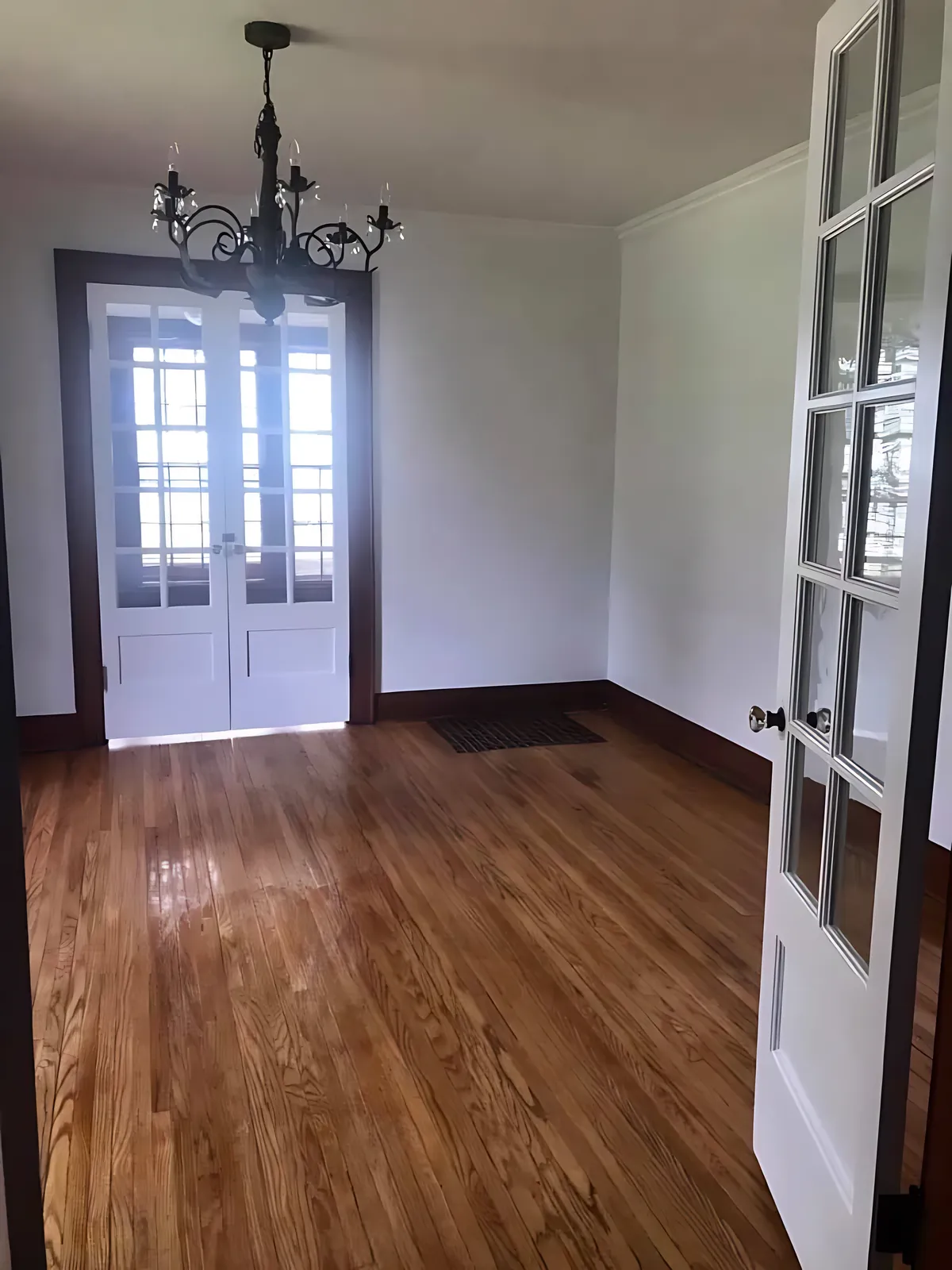 Room with french doors and chandelier